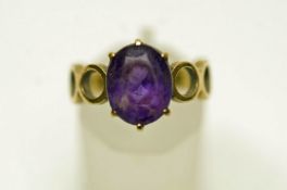 A single stone amethyst ring, stamped '333', probably German, finger size K,