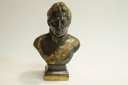 A Spelter bust of The Duke of Wellington with bronze patination and gilded highlights. 16cm high.