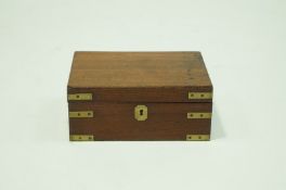A Victorian mahogany Writing Slope, inlaid with red leather and an original glass inkwell,