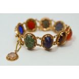 A stone set bracelet, with Egyptian control marks, the cabochons include paste, Cornelian,