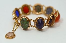 A stone set bracelet, with Egyptian control marks, the cabochons include paste, Cornelian,