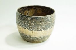 A Burmese silver metal rice bowl, circa 1915, with engraved floral bands,