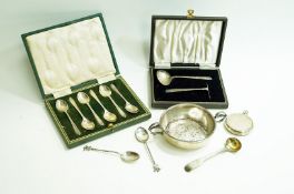 A silver two handled shallow bowl; a cased silver spoon and pusher set;