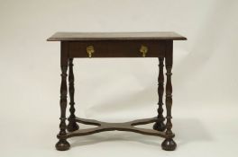 A Victorian oak side table with brass acorn drop handles, on crossed base with turned legs,