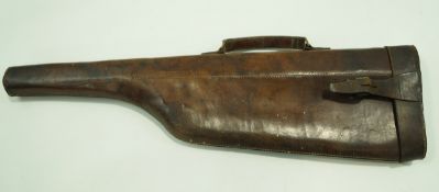 A leather mutton leg gun case with swing handle,