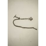 A silver watch chain, of graduated solid curb links, with a swivel and a T bar, also a fob attached,