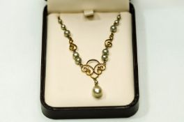 A 9 carat gold and simulated pearl necklace, 42 cm long, 4.