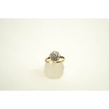 A diamond nine stone cluster ring, the eight-cut stones set in white to a yellow gold shank,