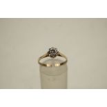 A 9 carat gold illusion set single stone diamond ring, finger size N1/2, 1.