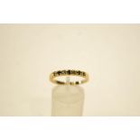 A gold plated stone set half hoop ring,