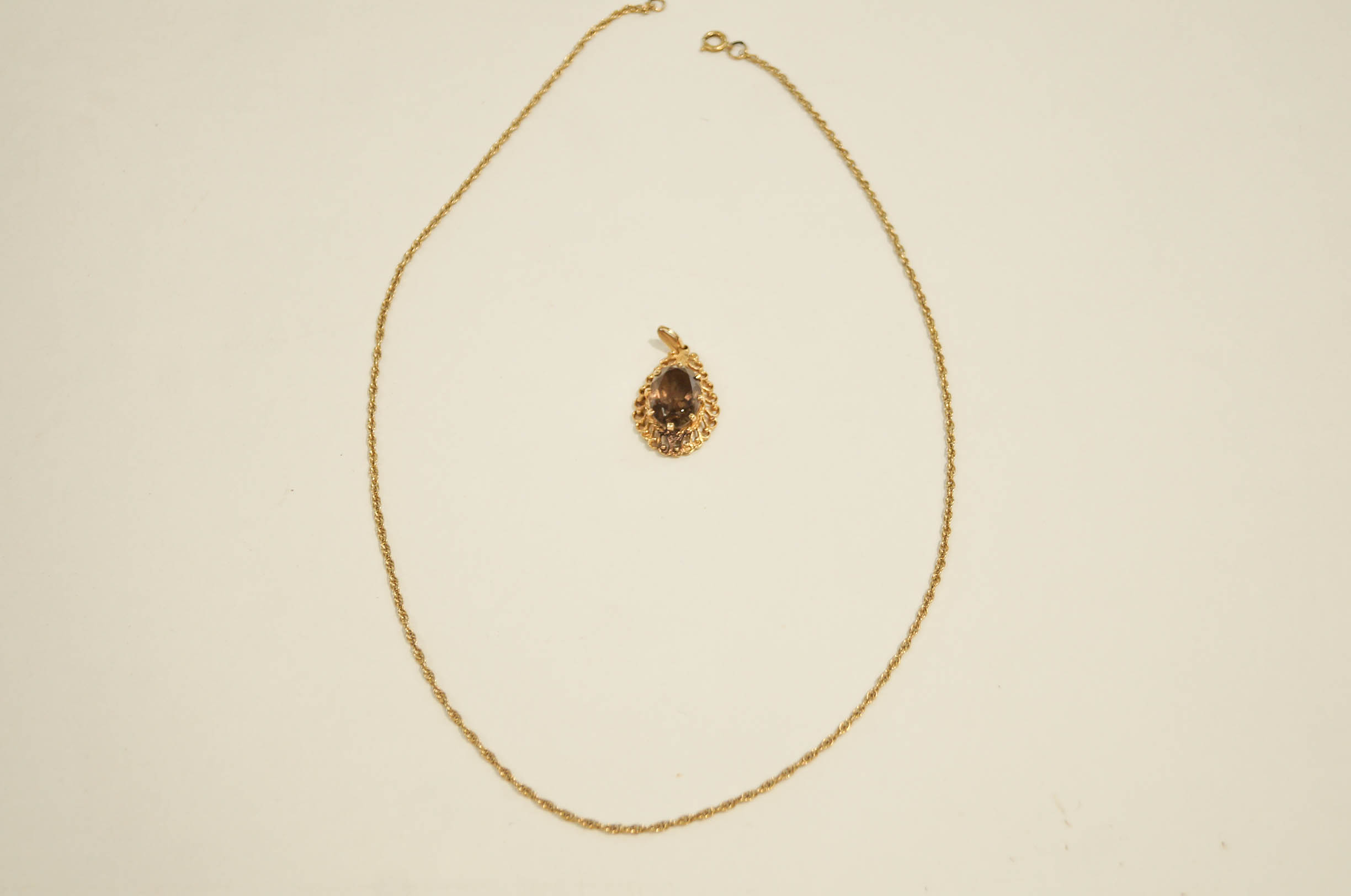 A smoky quartz pendant on a 9 carat gold mount, on a chain, 6. - Image 2 of 2