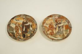 A pair of early 20th Century Japanese chargers, decorated with various figures,