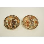 A pair of early 20th Century Japanese chargers, decorated with various figures,