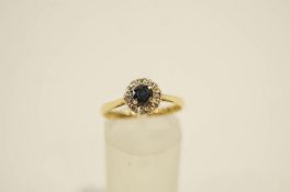 A sapphire and single cut diamond 18 carat gold cluster ring, finger size N, 2.