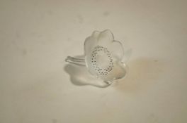 A Lalique ring holder, in the form of a flower, etched 'Lalique France' to the stem, 8.