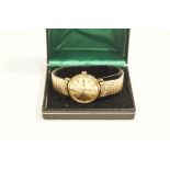 Rotary, a gentleman's 9 carat gold automatic wrist watch, with day/date 21 jewel movement,