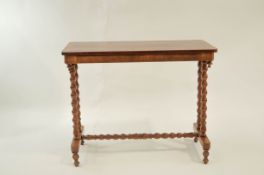 A Victorian crossbanded mahogany side table with bobbin turned supports,