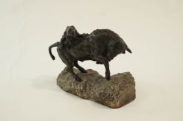 A bronze sculpture of a lioness attacking a bull on a rough cut marble stand, signed FACOTO.