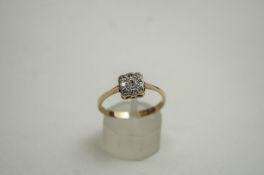 A diamond shaped square cluster ring, the nine single cut stones approx 0.