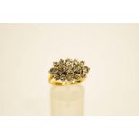 A fifteen stone diamond 18 carat gold cluster ring, the brilliant cuts set across the finger,