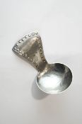 A Keswick School of Industrial Arts (KSIA) caddy spoon with a round bowl and a hammered tapering