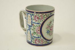 A 19th century Chinese mug decorated with a spray of flowers in pink,
