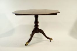 A George III style inlaid mahogany pedestal table with tapered stand and octagonal top,