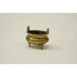 A 20th Century brass censer embossed with decoration of a bird in flight, seal mark to base,