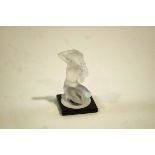 A Lalique glass Floreal model of a nude woman kneeling,