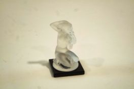 A Lalique glass Floreal model of a nude woman kneeling,