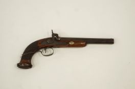 A 19th Century flintlock percussion pistol with steel mount and carved walnut grip,