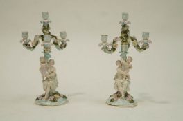 A pair of 19th Century German porcelain candelabra,