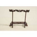 A Chinese hardwood jewellery/implement stand, carved with dragons,