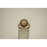 A 9 carat gold opal single stone ring, finger size O, 3.