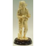 A late 19th century Japanese ivory okimono of a Woodcutter,