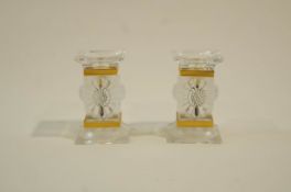 A pair of Lalique Paqueretted glass candlesticks,