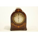 A small Edwardian mantle Clock with drum movement and inlaid arch top to case, height 18.