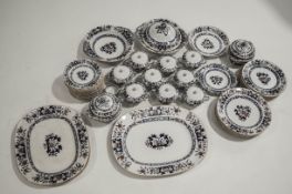 A Minton late 19th Century dinner service, pattern 8667-B467, comprising twin handled soup bowls,