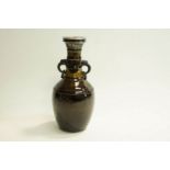 A late 19th Century Studio brown vase with a silver mount. London 1891.