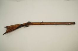 A 19th Century flintlock percussion rifle, with steel metal mounts, barrel engraved W WOLF.IN.