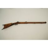 A 19th Century flintlock percussion rifle, with steel metal mounts, barrel engraved W WOLF.IN.