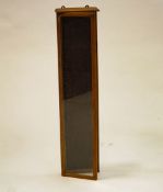 An early 20th century oak hanging display cabinet, with a fitted fabric interior, 105cm high,