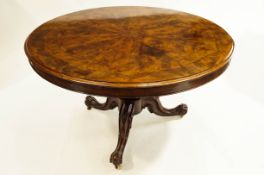 A mahogany circular tilt top table,