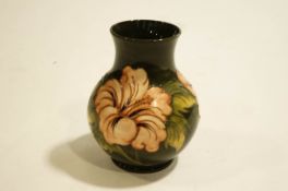 A Moorcroft Hibiscus pattern Vase of bulbous form, Impressed Moorcroft mark to base,