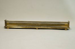 A pierced brass fender,