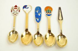 Five various Danish silver and enamel 'Christmas spoons', comprising four by Anton Michelsen,