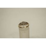 A 9 carat gold illusion set diamond ring, finger size L, 2.