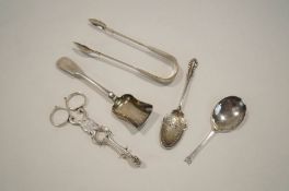 A George III silver shell bowl sugar nips; an Exeter fiddle pattern sugar spoon;