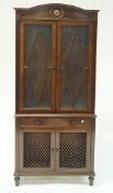 A pair of 20th Century mahogany bookcases each with astragal glazed doors above a drawer above two