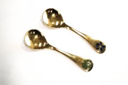 Two Georg Jensen silver gilt and enamel 'Christmas spoons' for 1975 'Woodruff' & 1977 'Sweet